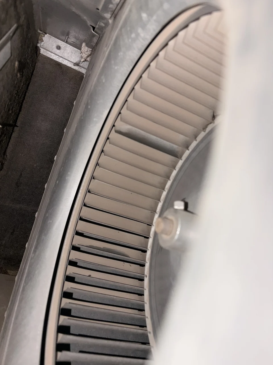 A second blower wheel with buildup before cleaning