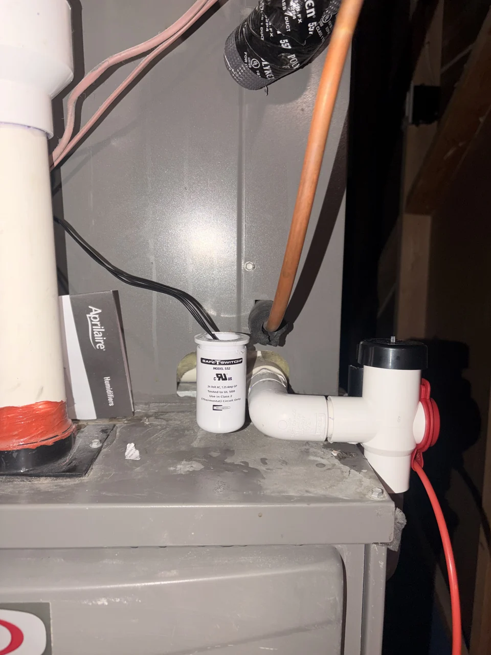 Condensate drain assembly and connected piping
