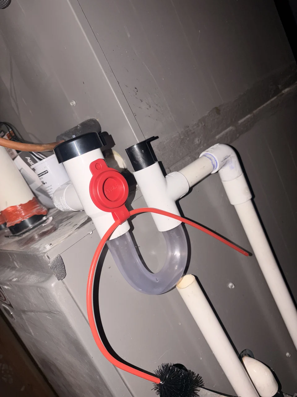 Another angle of the same condensate drain assembly
