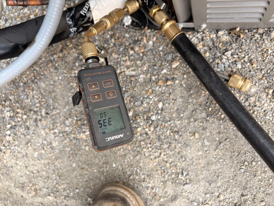 Digital service gauge and hoses during HVAC service
